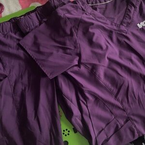 I have 5 sets of scrubs. Tops do have embroidered logo but, pants are plain.